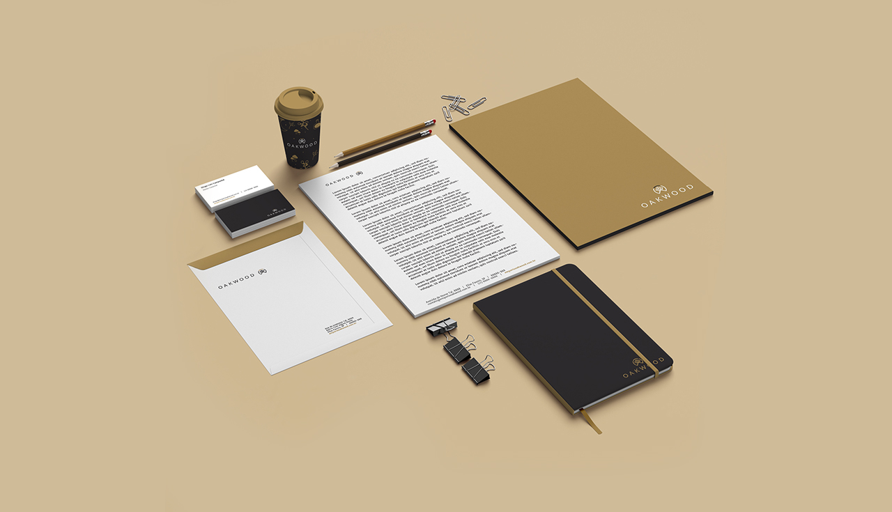 Papelaria institucional Oakwood em preto, branco e dourado